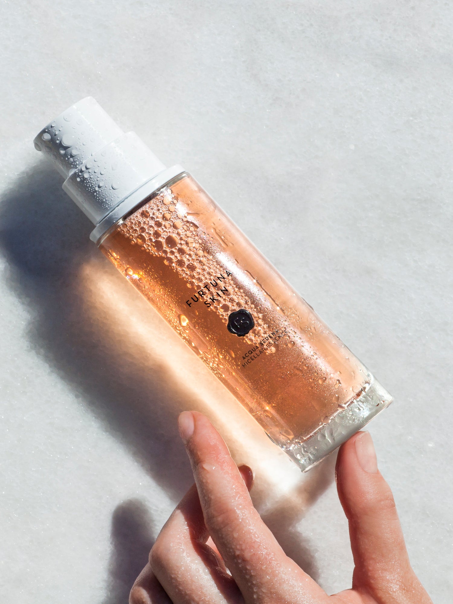 Furtuna Skin Micellar Cleansing Essence bottle with water droplets