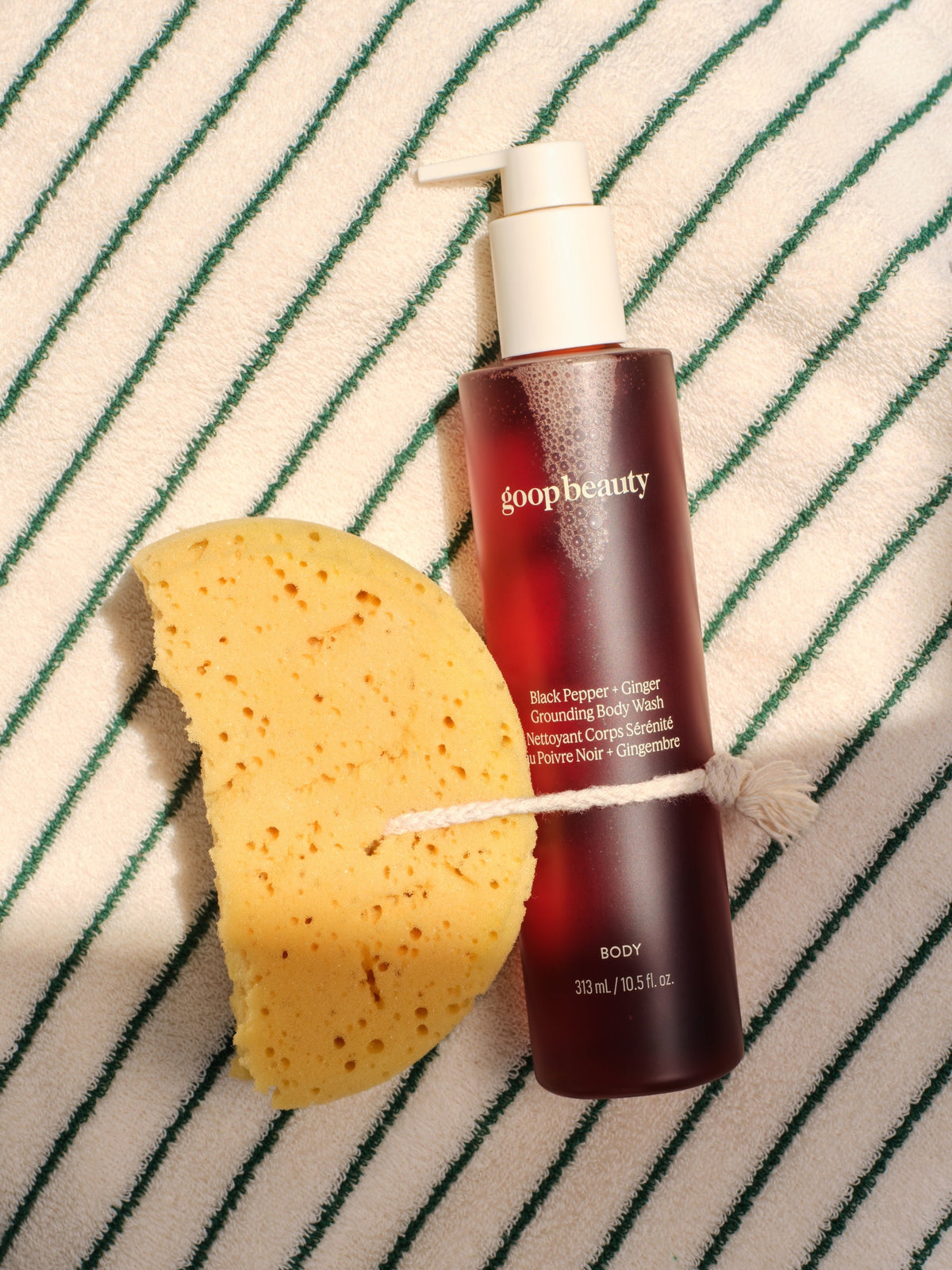 goop beauty Black Pepper + Ginger Grounding Body Wash with natural sponge