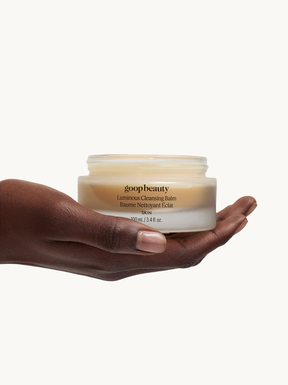 goop beauty Luminous Cleansing Balm in hand