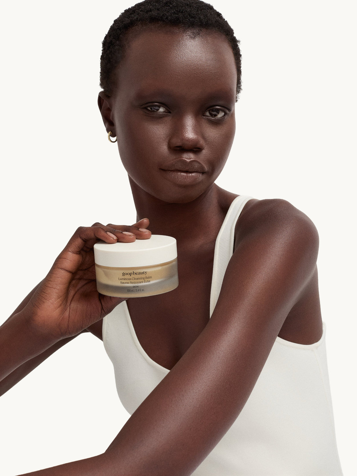 goop beauty Luminous Cleansing Balm in hand