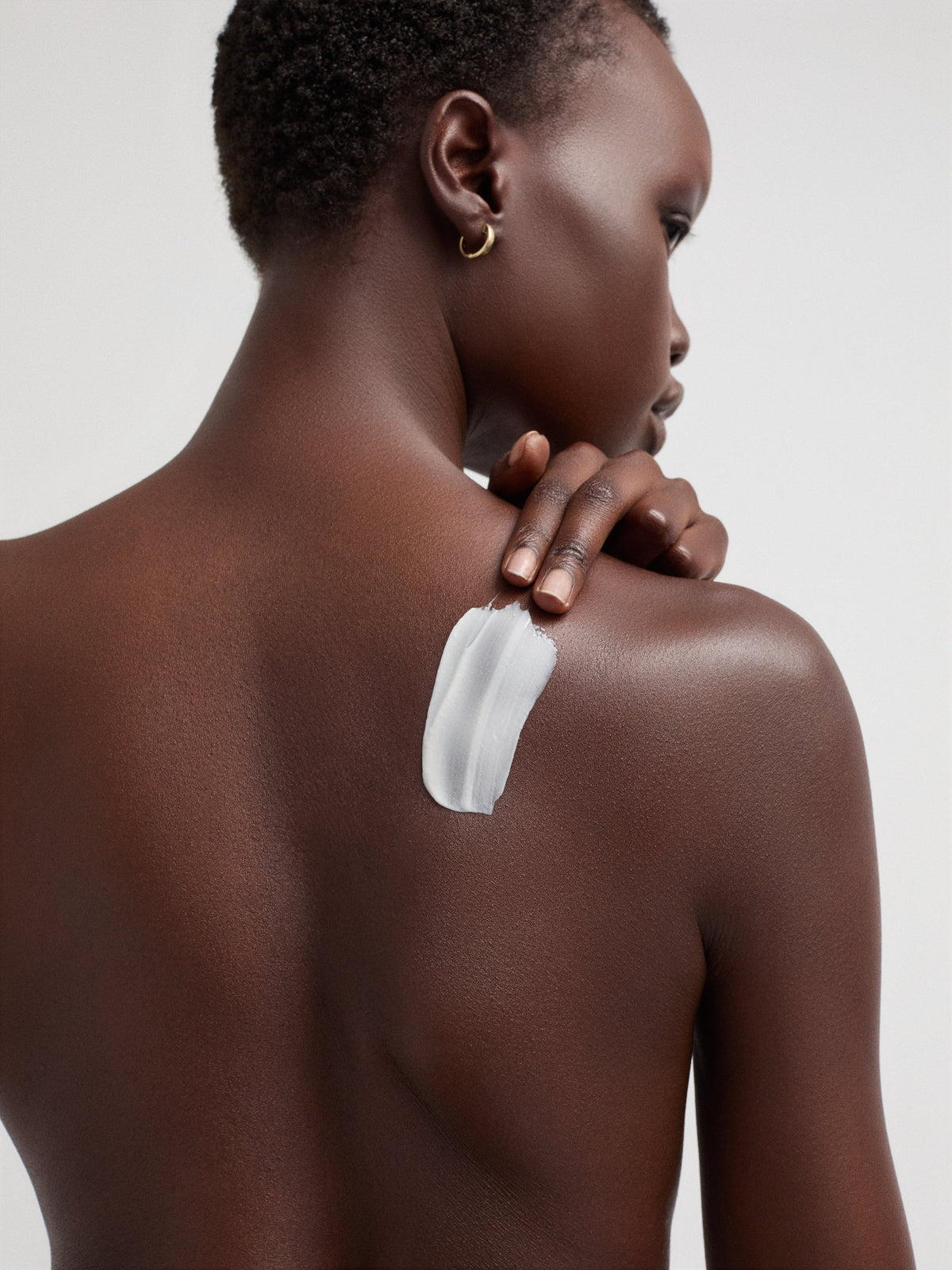 goop beauty Nourishing Repair Body Butter applied to skin
