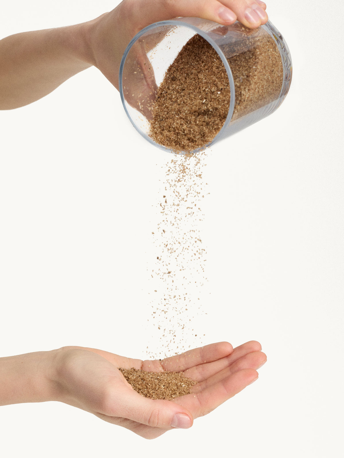 GOOP BEAUTY The Martini Emotional Detox Bath Soak being poured into a hand
