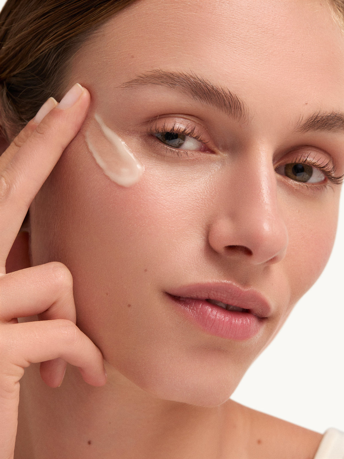 goop beauty Youth-Boost Peptide Serum applied to the eye area