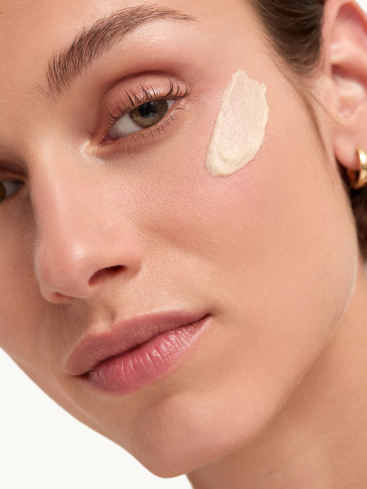 goop Microderm Instant Glow Exfoliator applied to facial skin