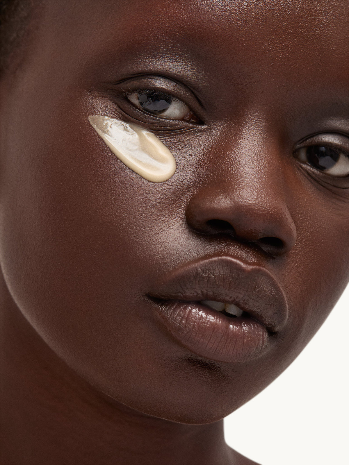 goop Vita-C Brightening Eye Cream applied under the eyes