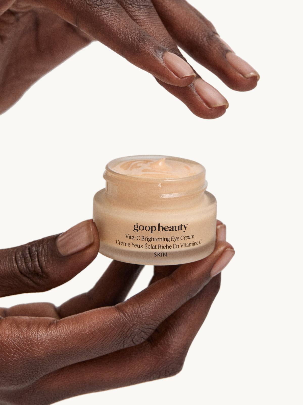 goop Vita-C Brightening Eye Cream held in hands
