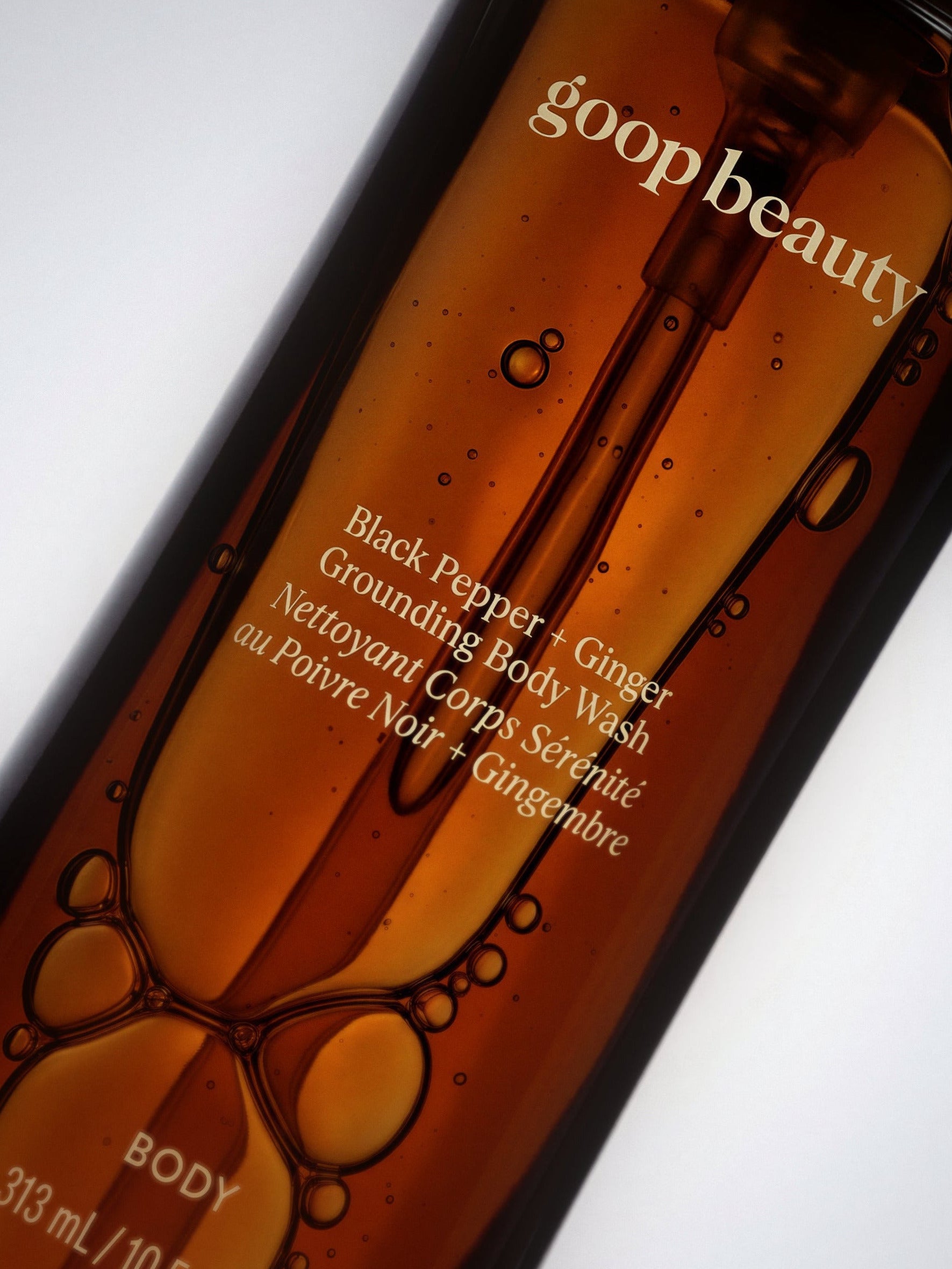 A closeup of the goop beauty Black Pepper + Ginger Grounding Body Wash