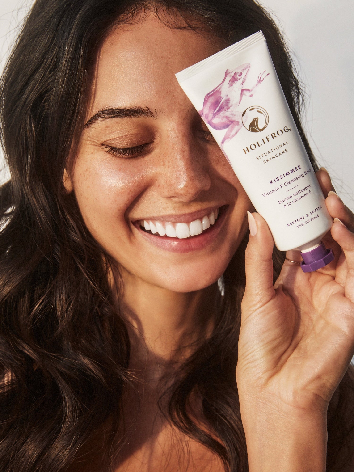 Model holding HOLIFROG Kissimmee Vitamin F Cleansing Balm
