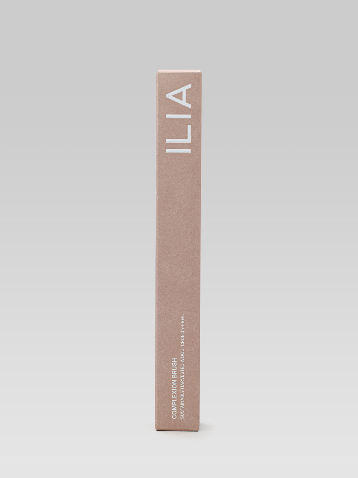 ILIA BEAUTY Complexion Brush packaging in a beige rectangular box with white ILIA branding.