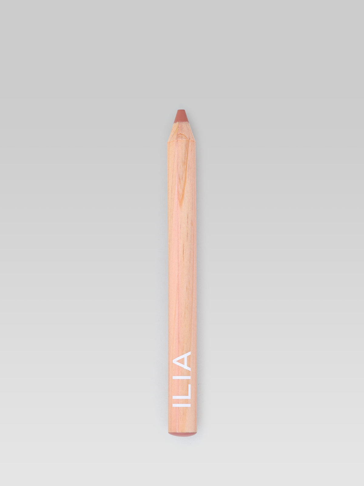 ILIA Beauty Lip Sketch Hydrating Crayon in Banquette, a nude rose lip crayon shown against a light background.