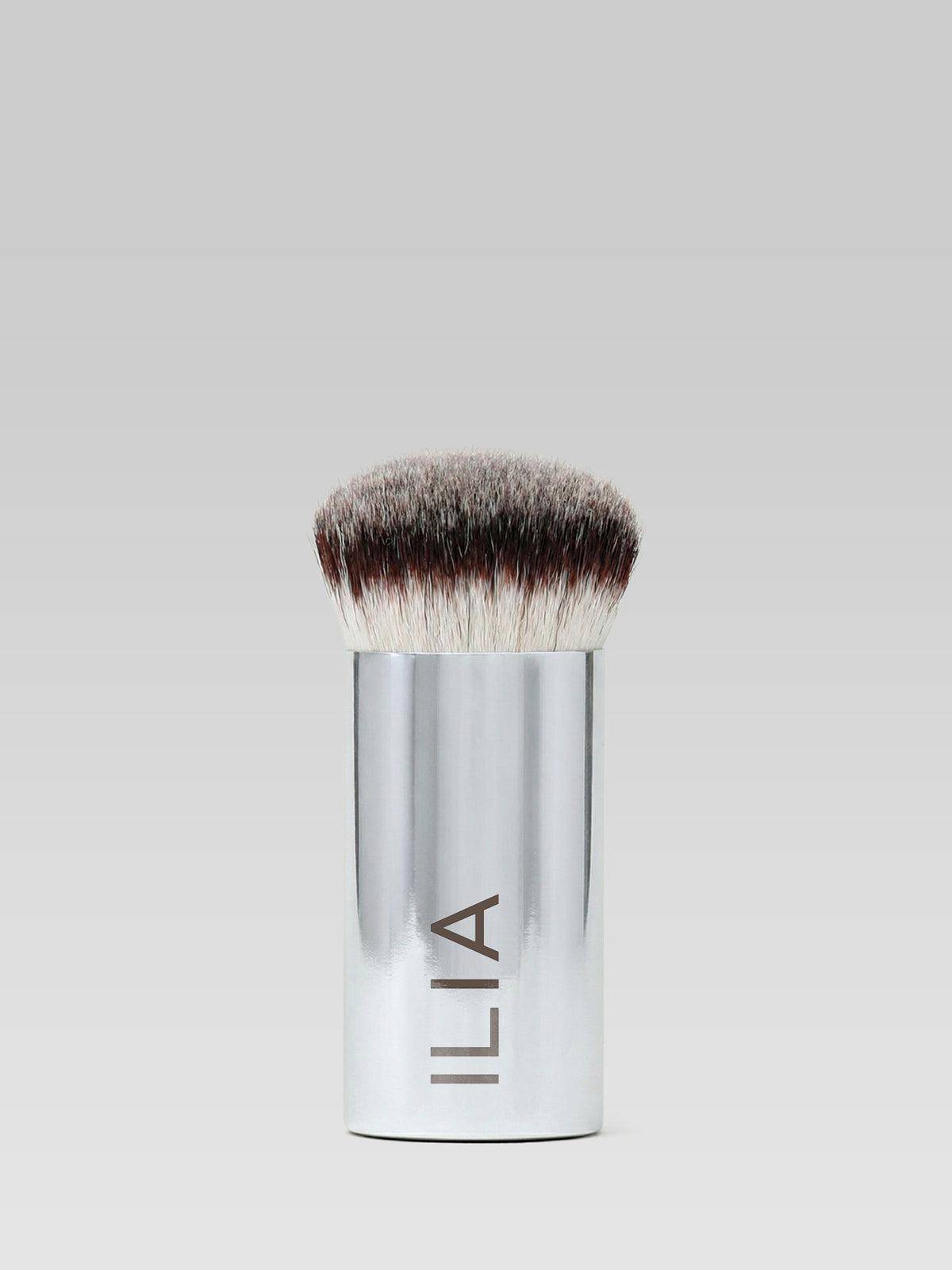 ILIA Beauty Perfecting Buff Brush with dense rounded bristles and a silver handle