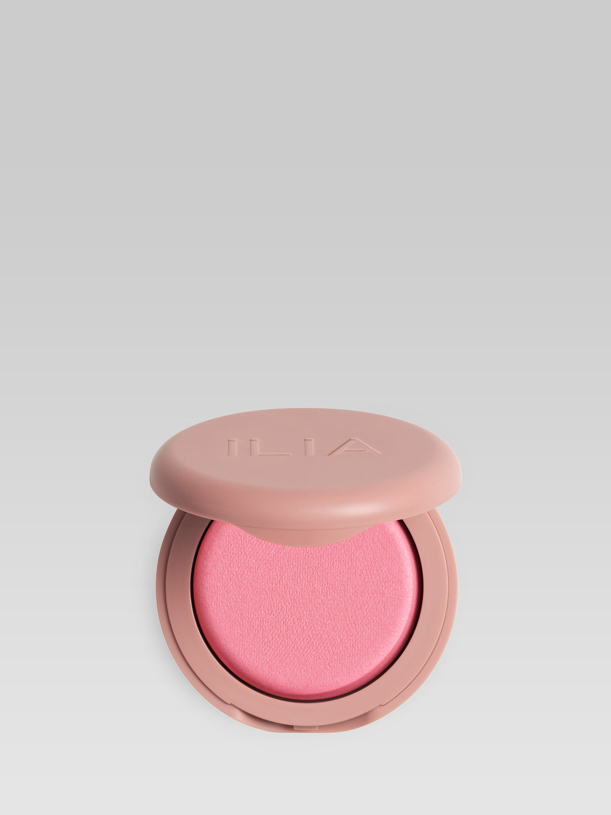 ILIA Beauty Soft Focus Blurring Blush in Closer, a baby pink powder blush in an open compact