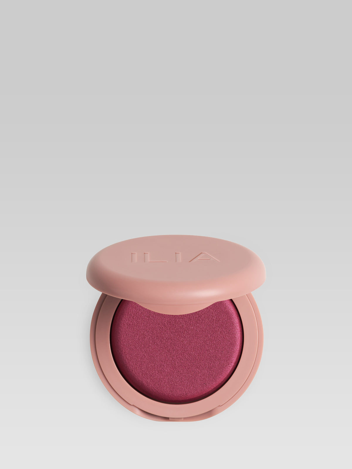 ILIA Beauty Soft Focus Blurring Blush in Magnetic, a rich berry powder blush in a pink compact