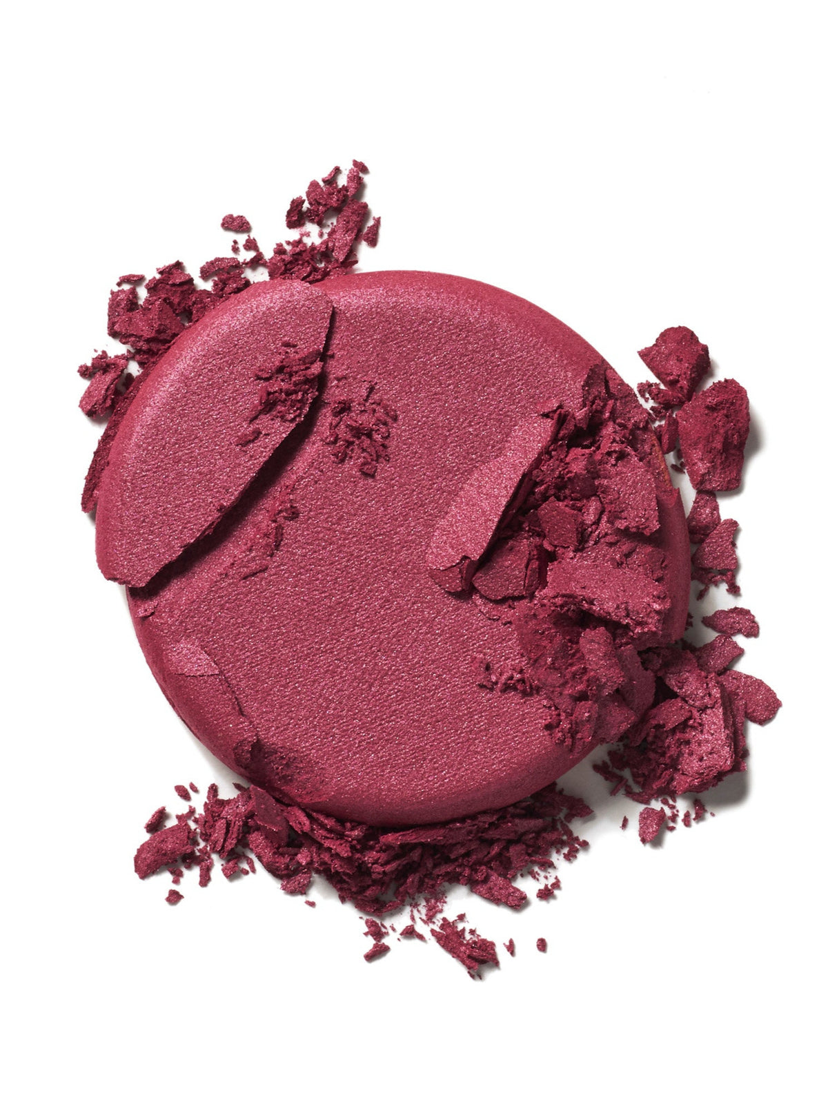 ILIA Beauty Soft Focus Blurring Blush in Magnetic, a rich berry powder blush swatch with crushed pigment on a white background