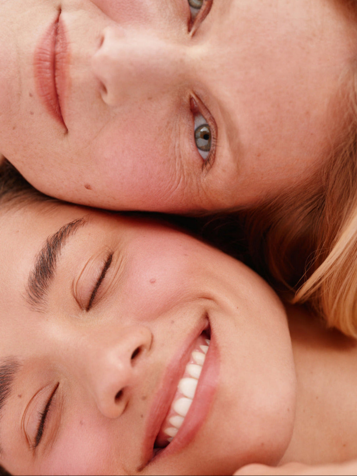 Two models with natural-looking rosy cheeks wearing ILIA Beauty Soft Focus Blurring Blush