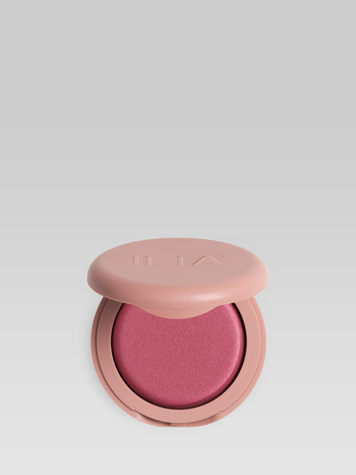 ILIA Beauty Soft Focus Blurring Blush in Sensation, a berry rose powder blush in a pink compact