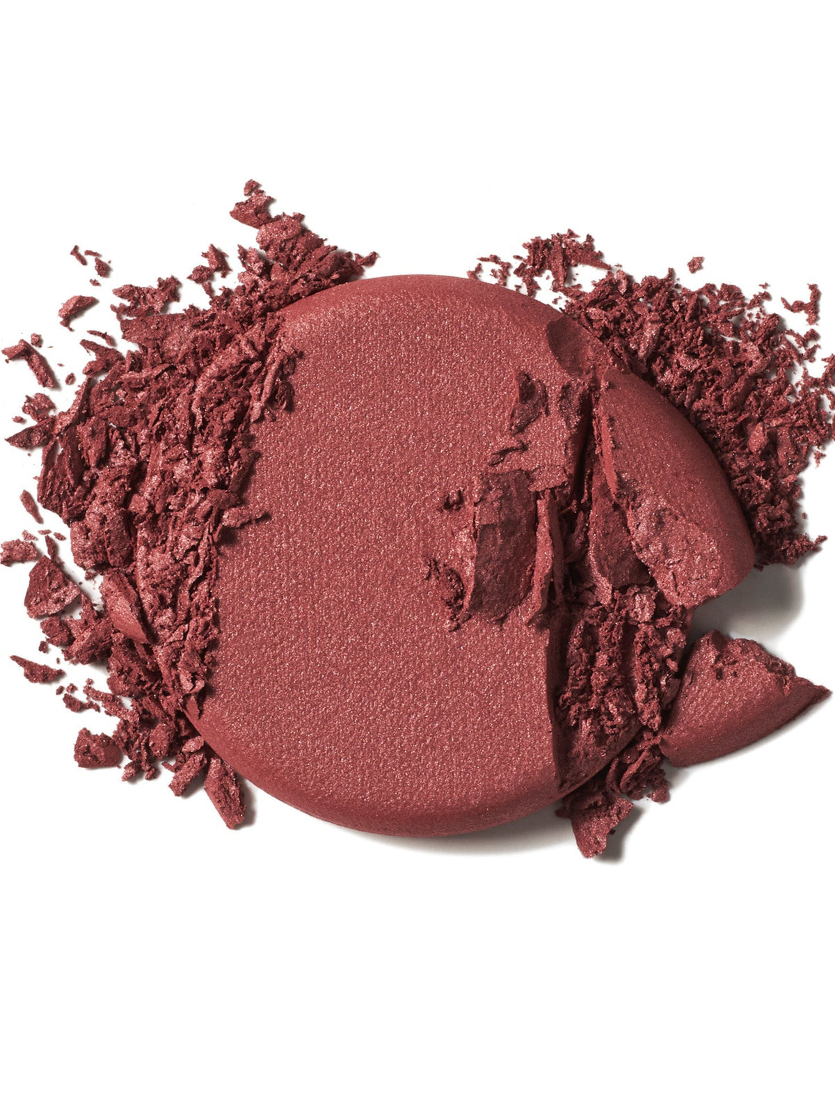 ILIA Beauty Soft Focus Blurring Blush in Wonder, a deep terracotta powder blush swatch with crushed pigment on a white background