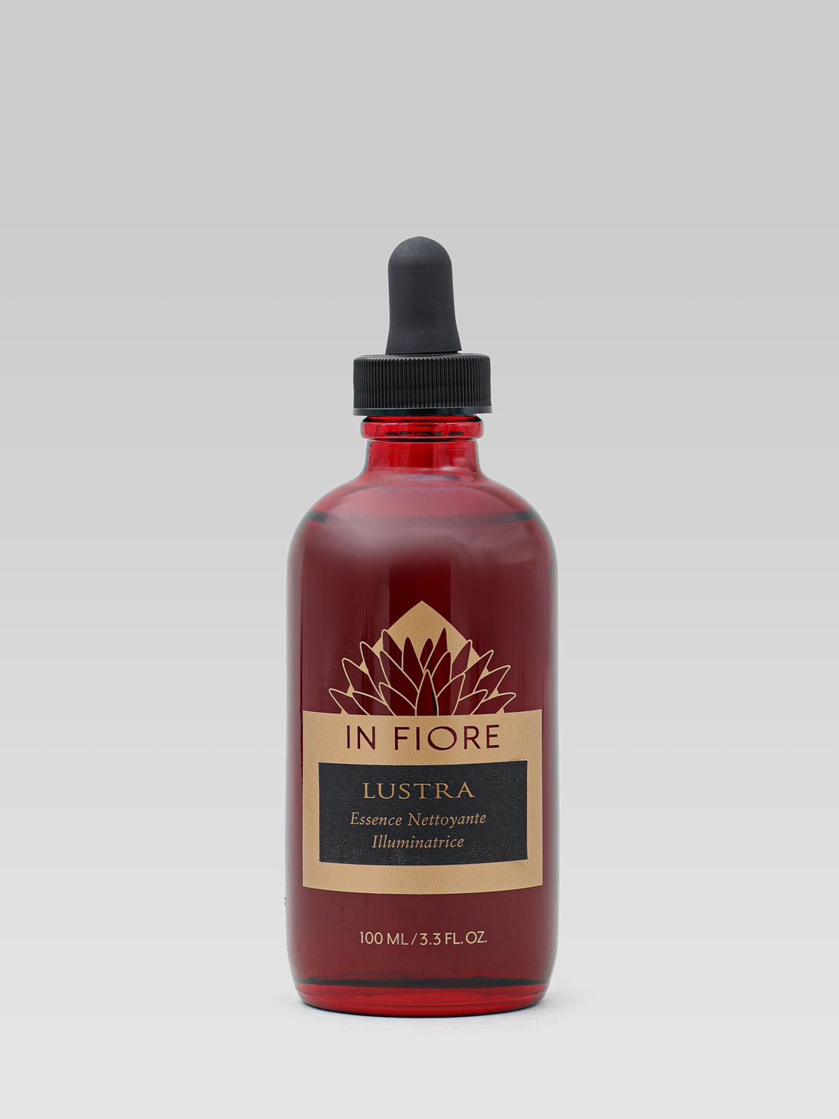 IN FIORE Lustra Illuminating Cleansing Essence in a red glass bottle with a black dropper cap and gold label on a white background