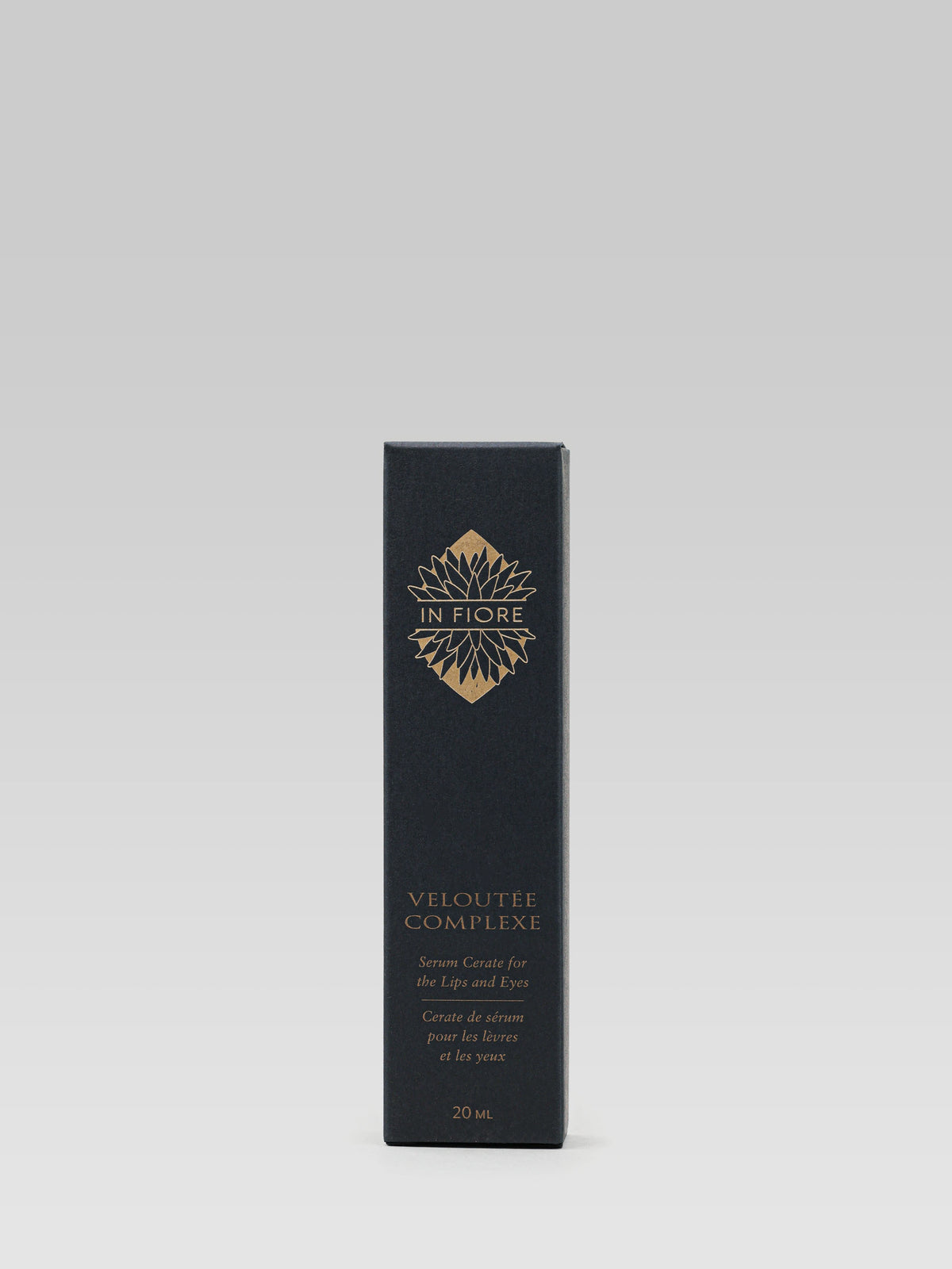 IN FIORE Veloutée Complexe Lip and Eye Balm black carton packaging with gold lettering on a light grey background