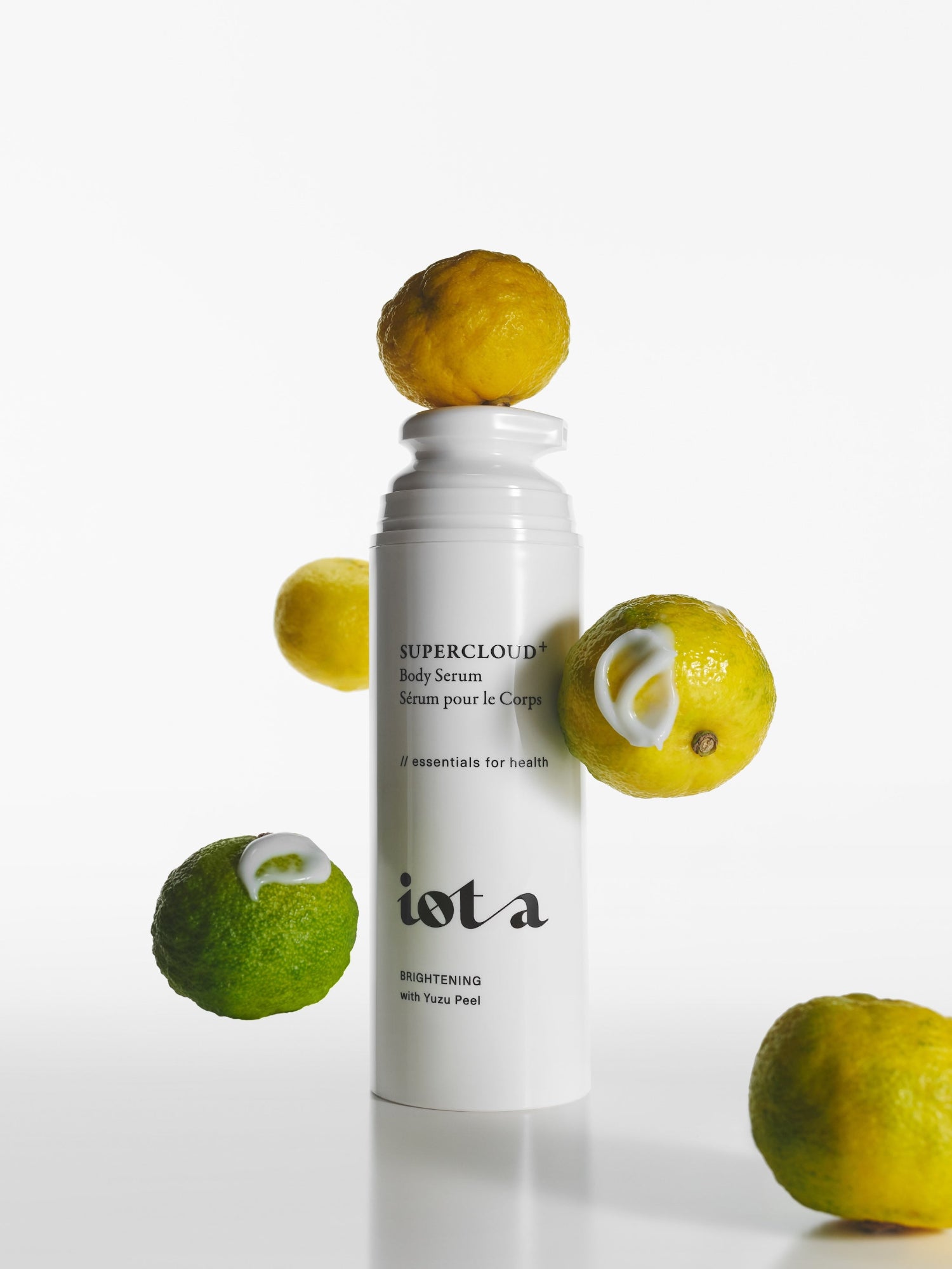 IOTA Supercloud+ Body Serum with Yuzu Peel surrounded by citrus fruits