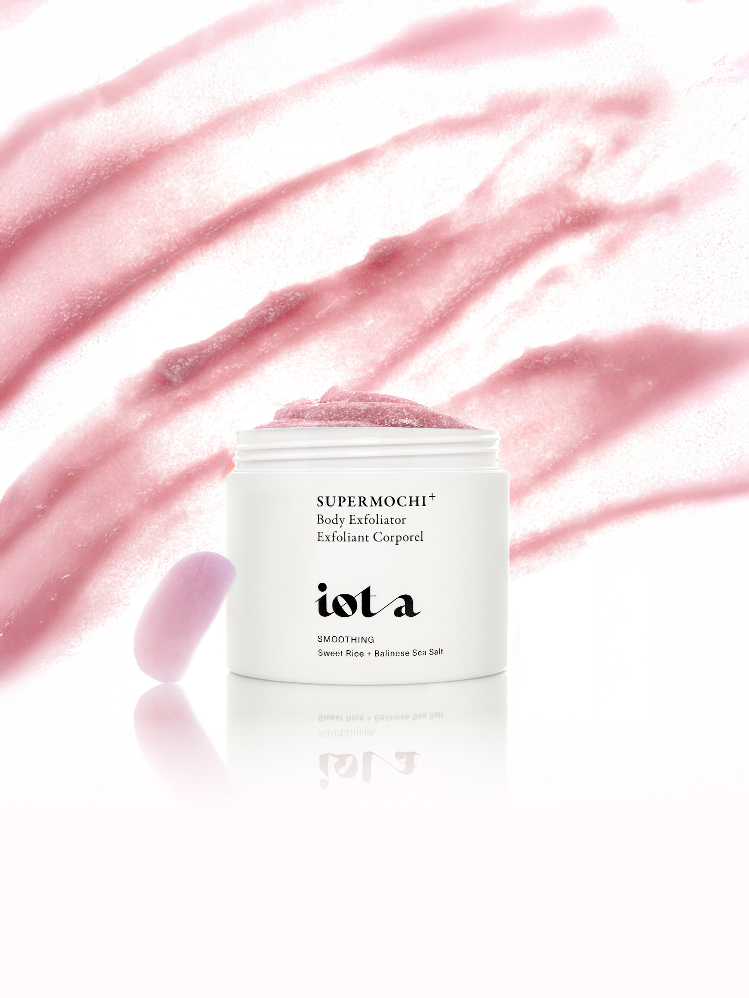 IOTA Supermochi+ Body Exfoliator showing its pink exfoliating scrub texture