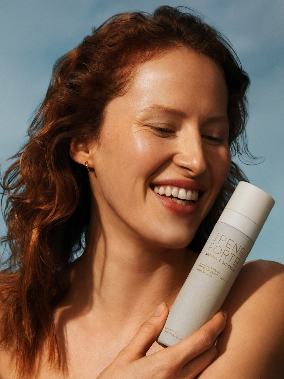 Woman holding IRENE FORTE Prickly Pear Face Cream