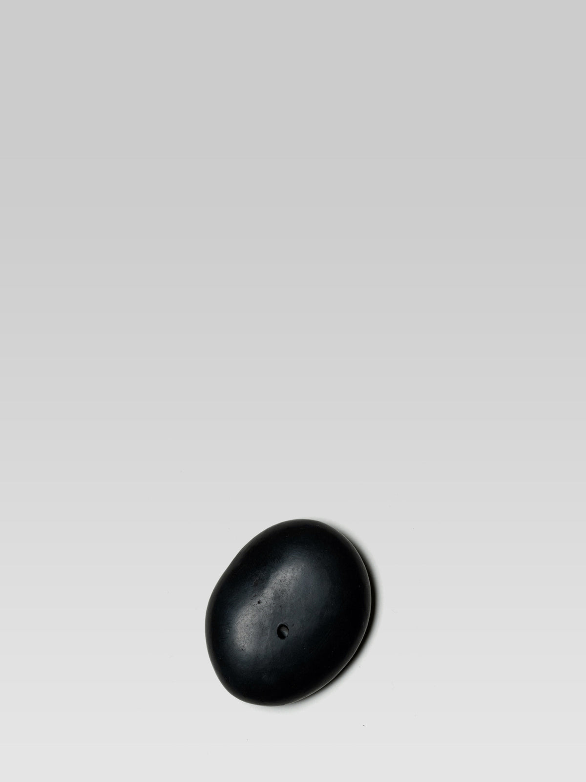 JJIMJIL black basalt stone incense holder with a naturally formed, smooth oval shape