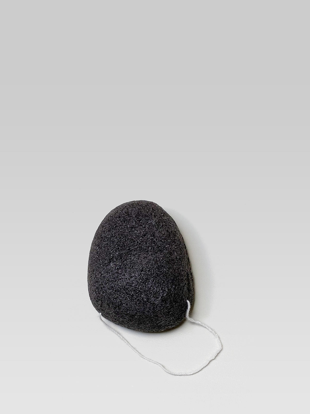JJIMJIL Charcoal Konjac Facial Sponge, a natural black konjac sponge with purifying charcoal for gentle facial cleansing and exfoliation