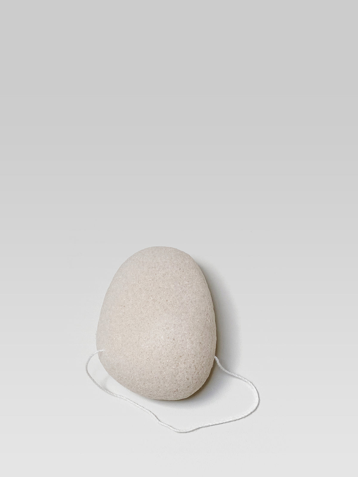 JJIMJIL Pure Konjac Facial Sponge in natural ivory, a plant-based sponge for gentle facial cleansing and exfoliation