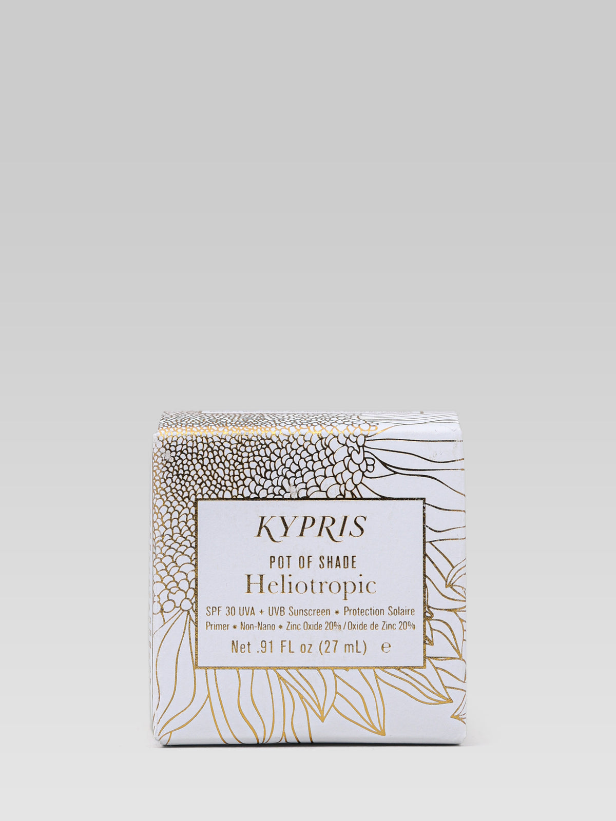 KYPRIS Pot of Shade Heliotropic SPF 30 sunscreen and primer in white packaging with a gold botanical design.