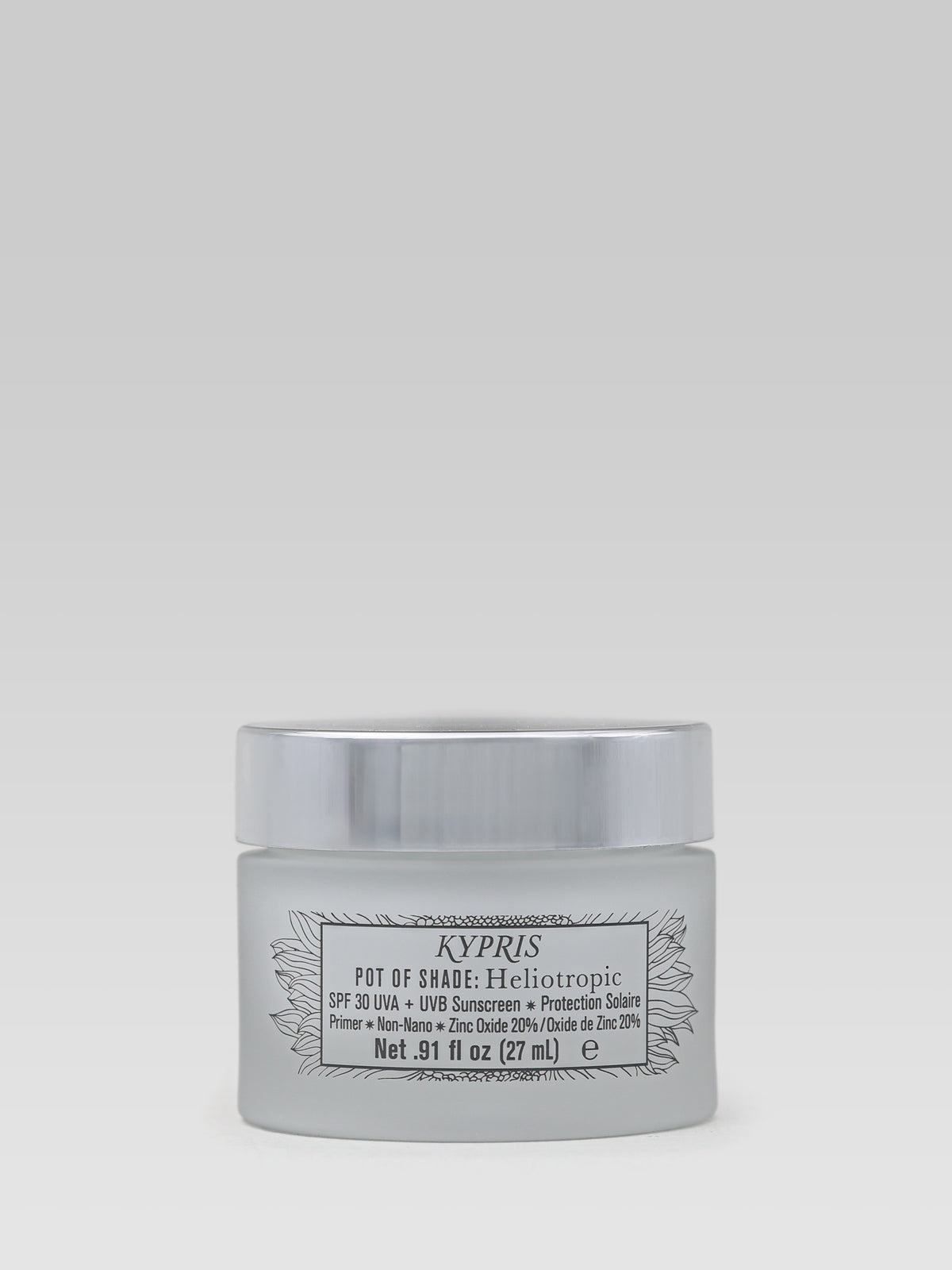 KYPRIS Pot of Shade Heliotropic SPF 30 sunscreen and primer in a white jar with a silver lid.