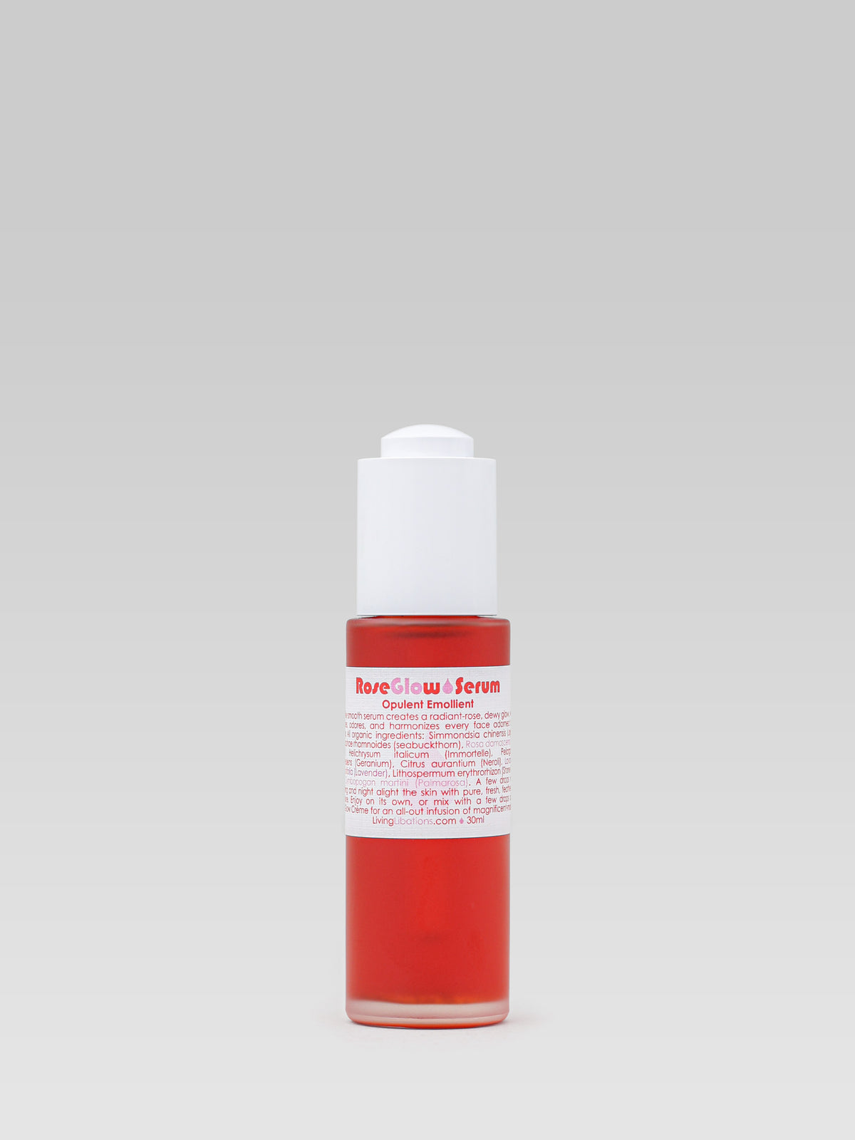 Living Libations Rose Glow Serum facial serum in a red bottle on a light background