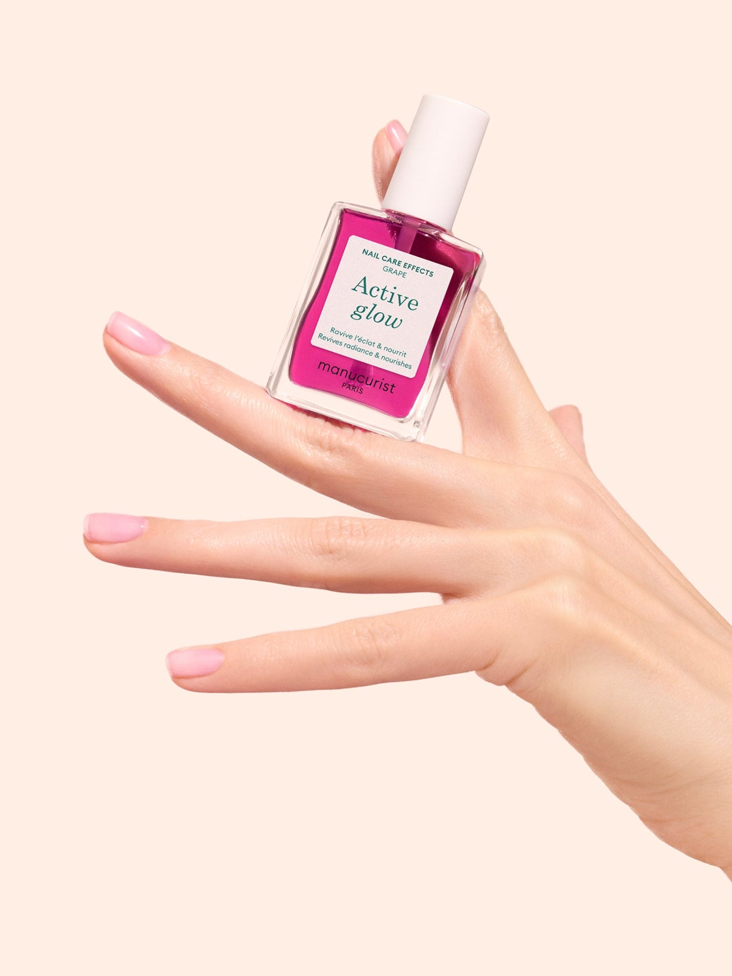 MANUCURIST Active Glow Grape nail treatment held in hand