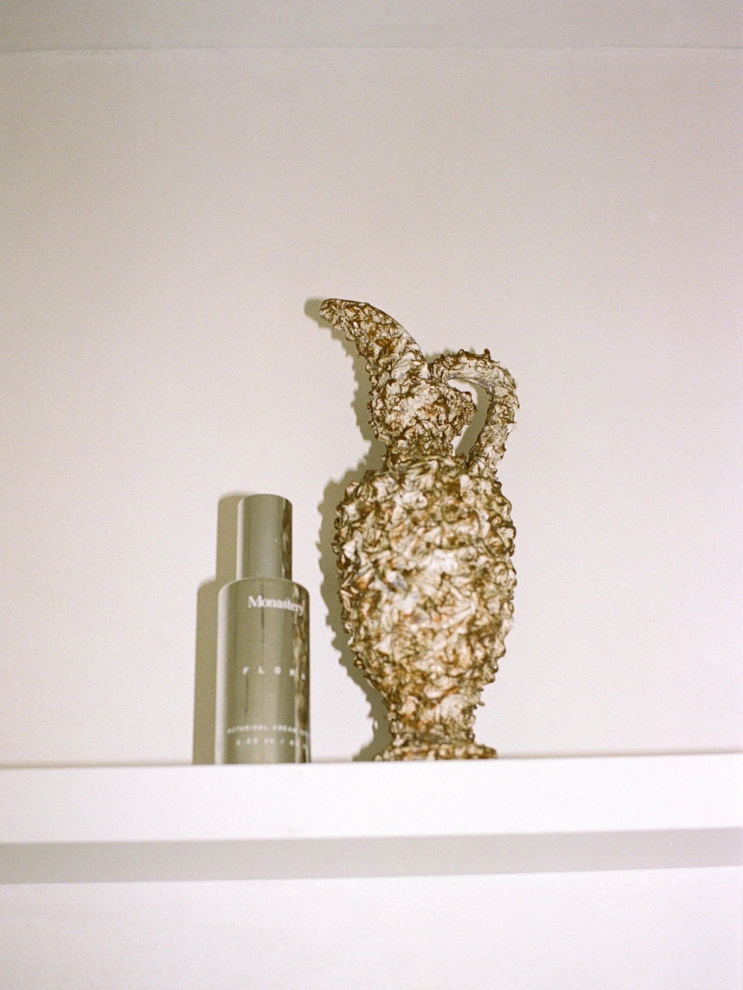 MONASTERY Flora Cream Serum bottle with sculptural vase