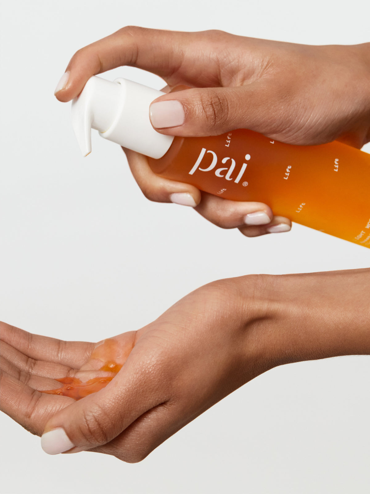 PAI Skincare Light Work Rosehip Fruit Extract Cleansing Oil dispensed onto hands