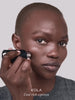 WESTMAN ATELIER Face Trace Contour Stick in Kola applied to the face