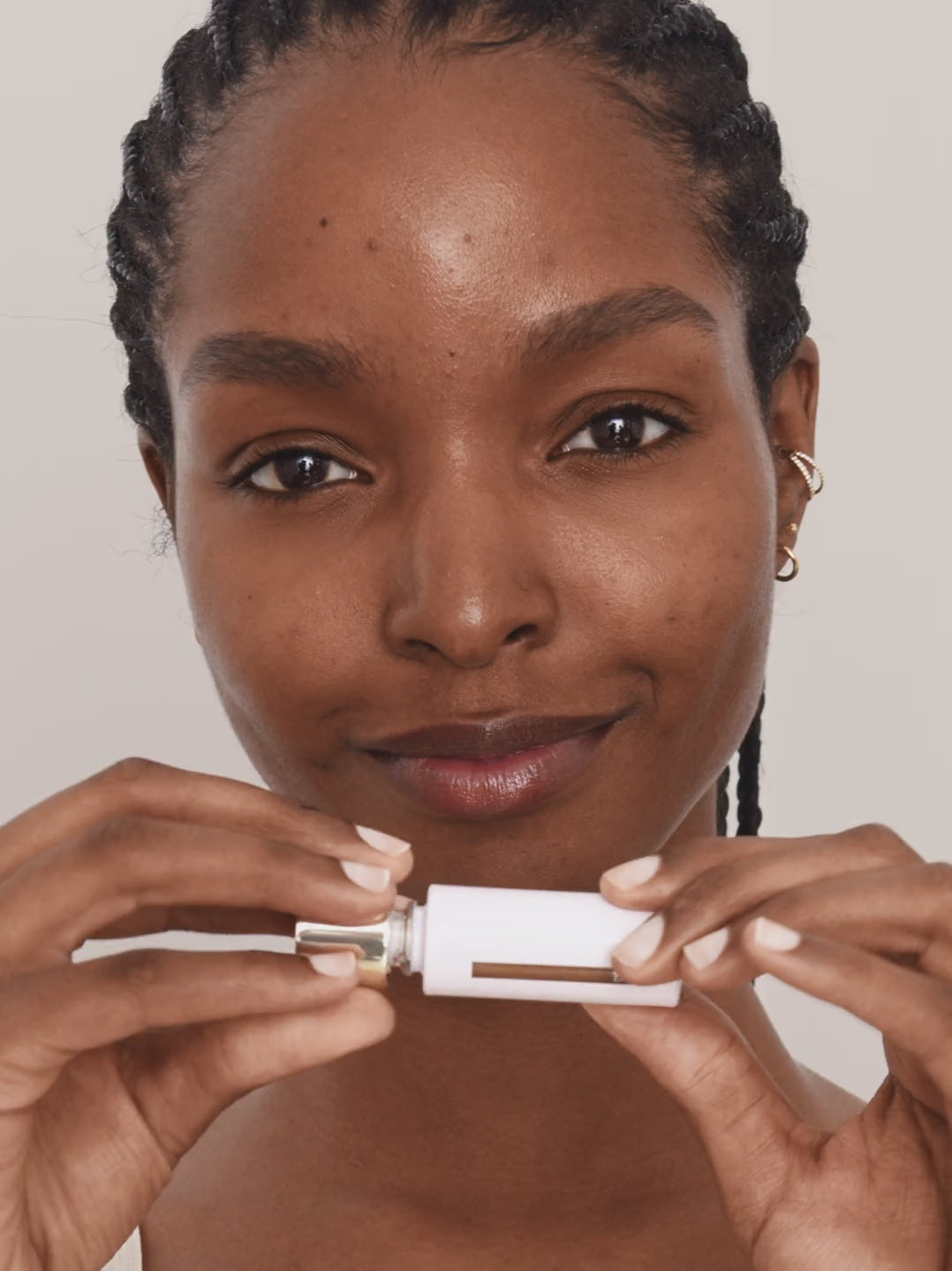 WESTMAN ATELIER Vital Skincare Concealer in Atelier D2 being applied