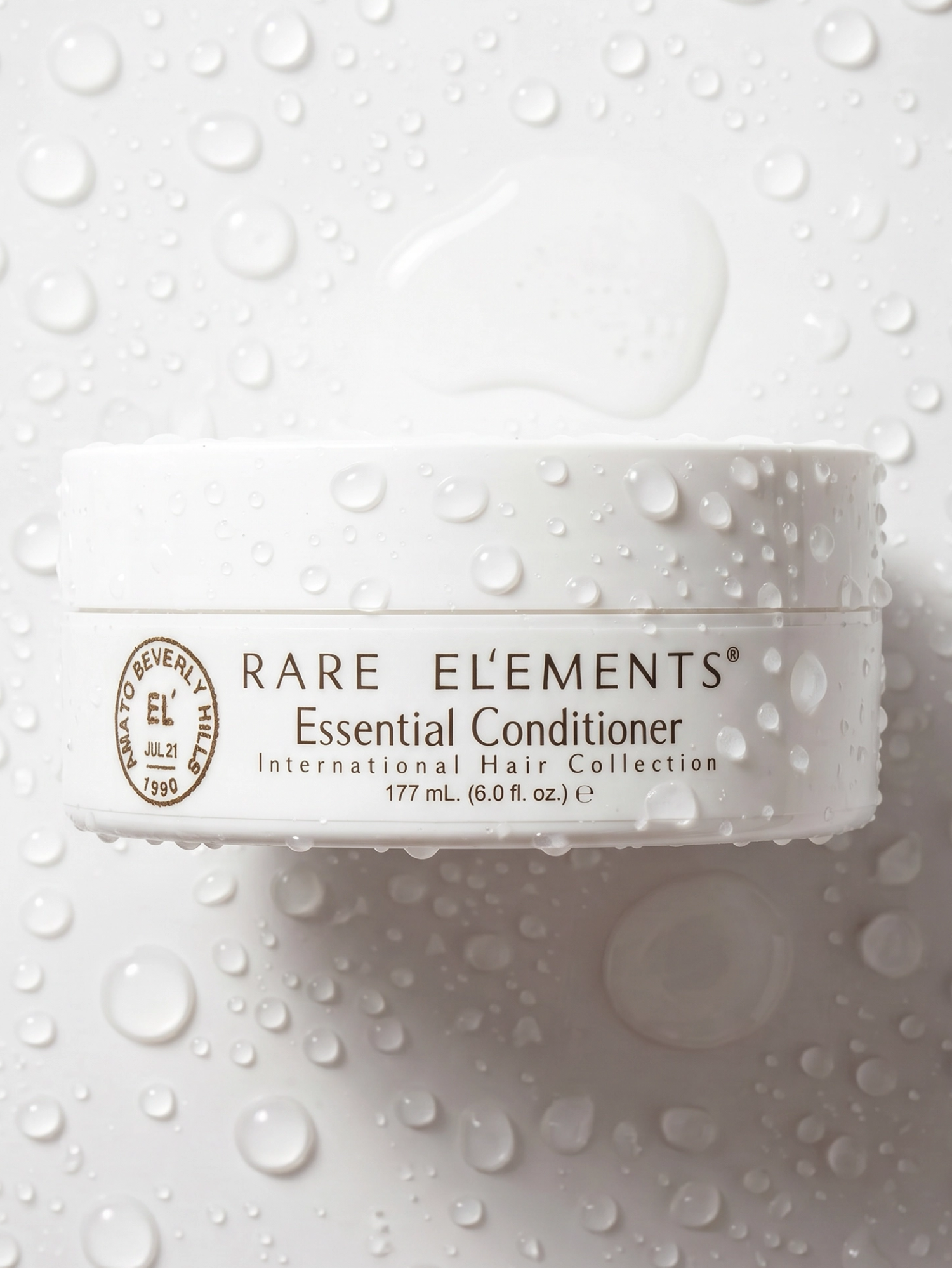 RARE ELEMENTS Essential Conditioner 177 ml with water droplets