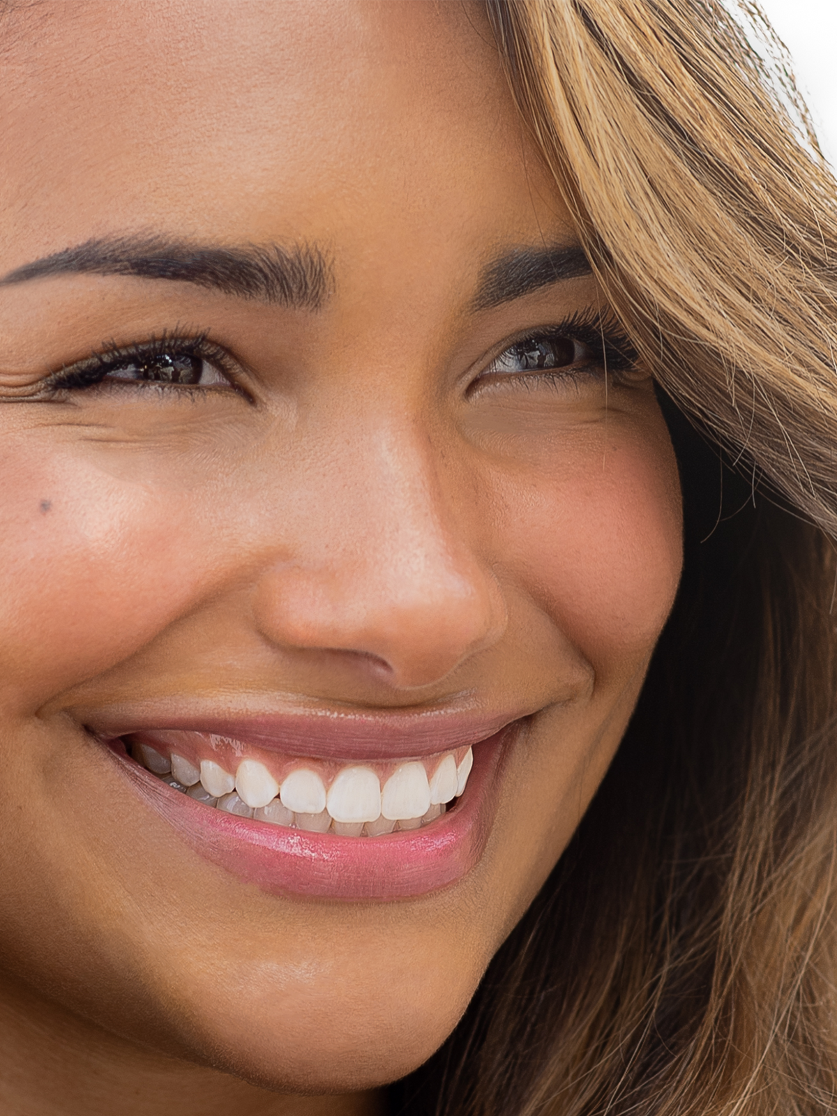 RMS Beauty Buriti Cream Bronzer blended onto the skin to create a warm, bronzed finish