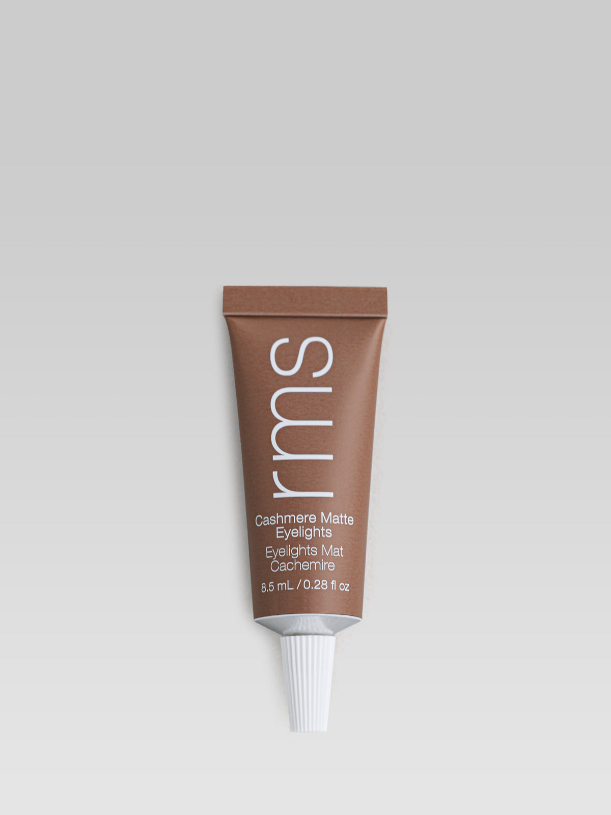 RMS Beauty Cashmere Matte Eyelights in Mossy Stone, a neutral brown cream eyeshadow in a tube