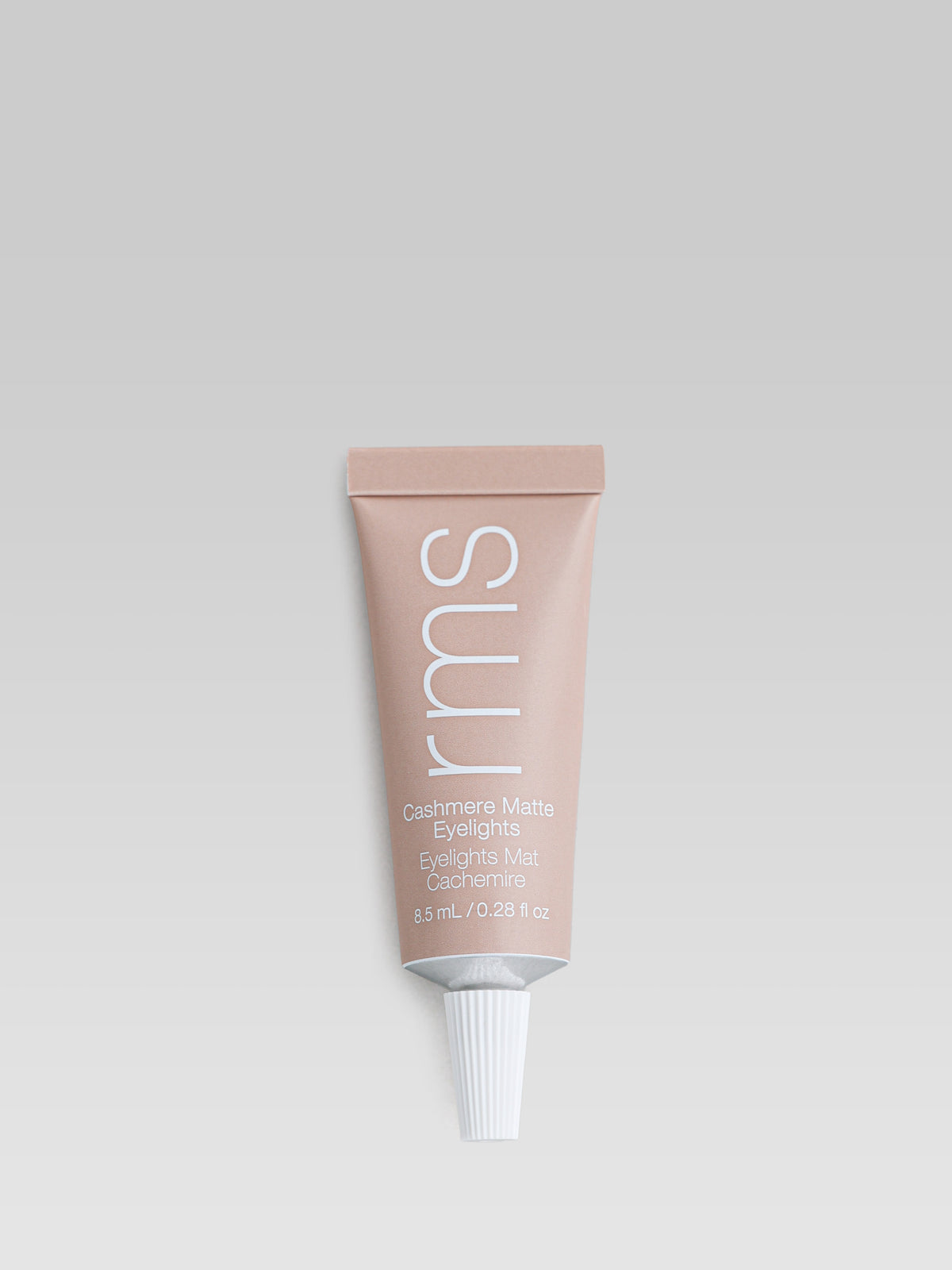 RMS Beauty Cashmere Matte Eyelights in Tundra Taupe in a beige squeeze tube