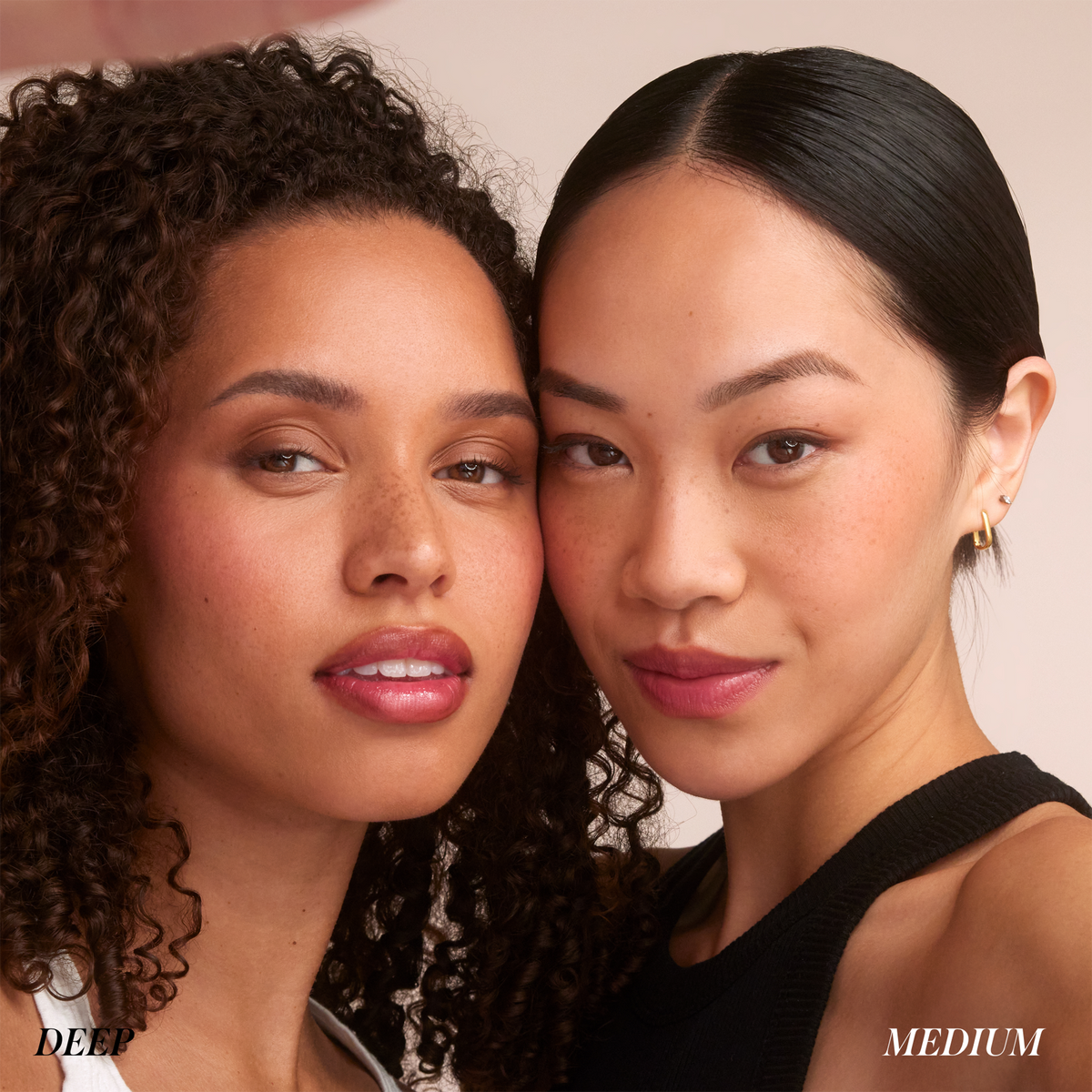 Two models showcasing RMS Beauty Hydra Setting Powder in Deep and Medium shades