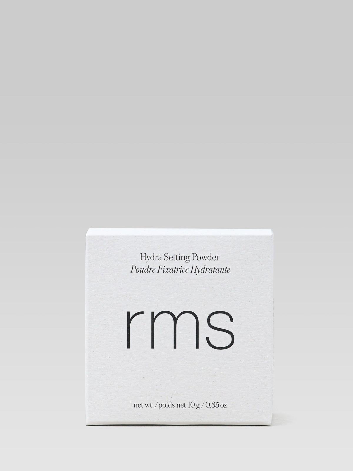 RMS Beauty Hydra Setting Powder in its white product packaging