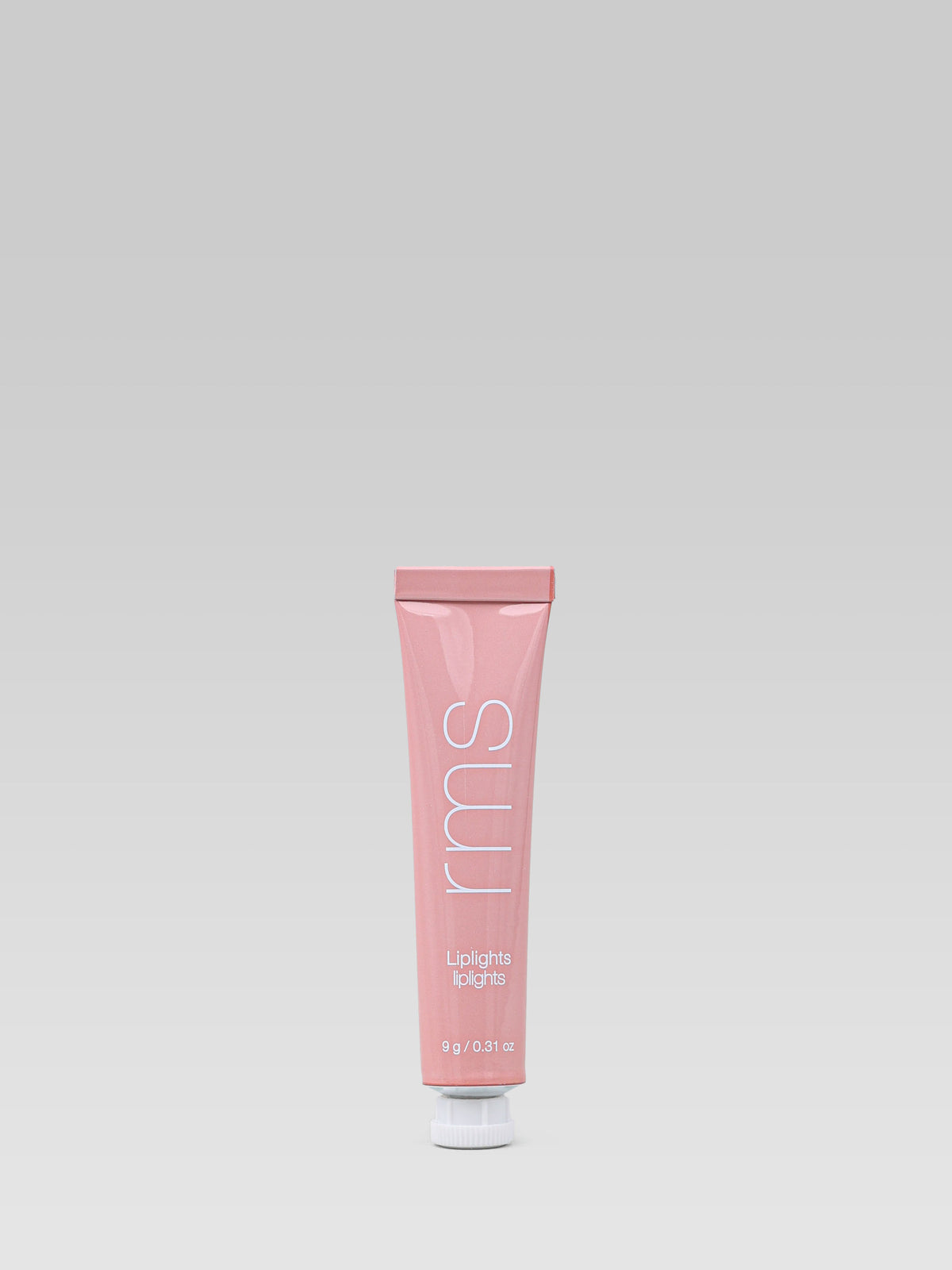 RMS Beauty Lip Lights Cream Lip Gloss in Bare shown in its pink squeeze tube against a neutral background