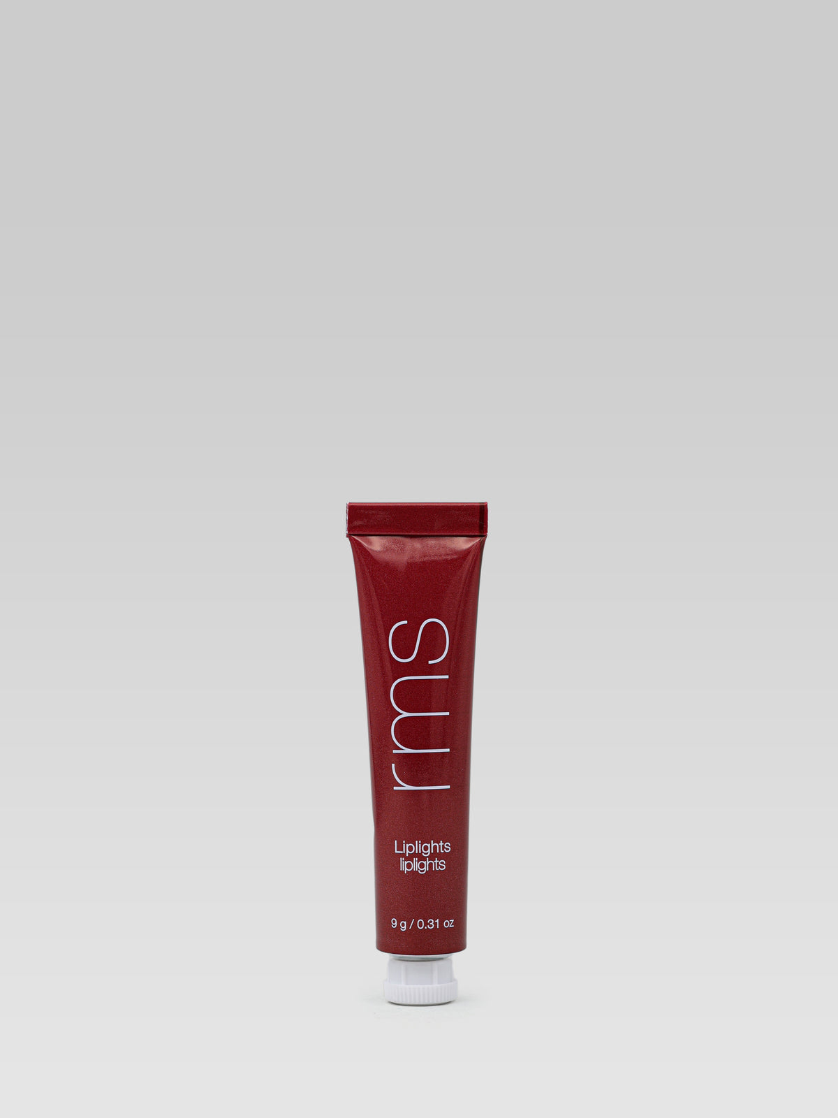 RMS Beauty LipLights Cream Lip Gloss in Rhythm, a deep berry-red gloss in a tube