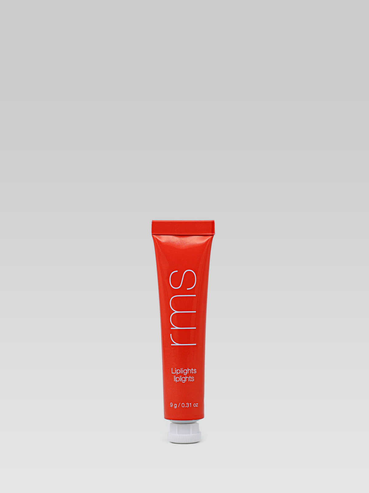 RMS Beauty LipLights Cream Lip Gloss in Babette, a vibrant coral-red lip gloss in a squeeze tube