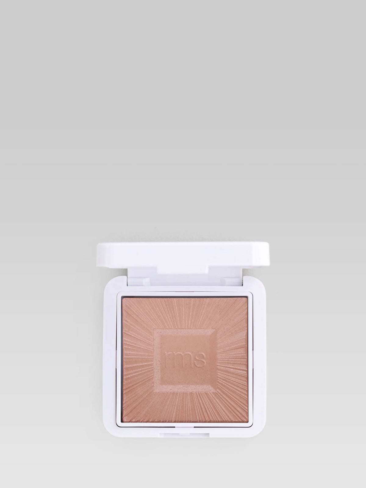 RMS Beauty ReDimension Hydra Bronzer in Tan Lines in an open compact, showing the embossed bronzer powder.