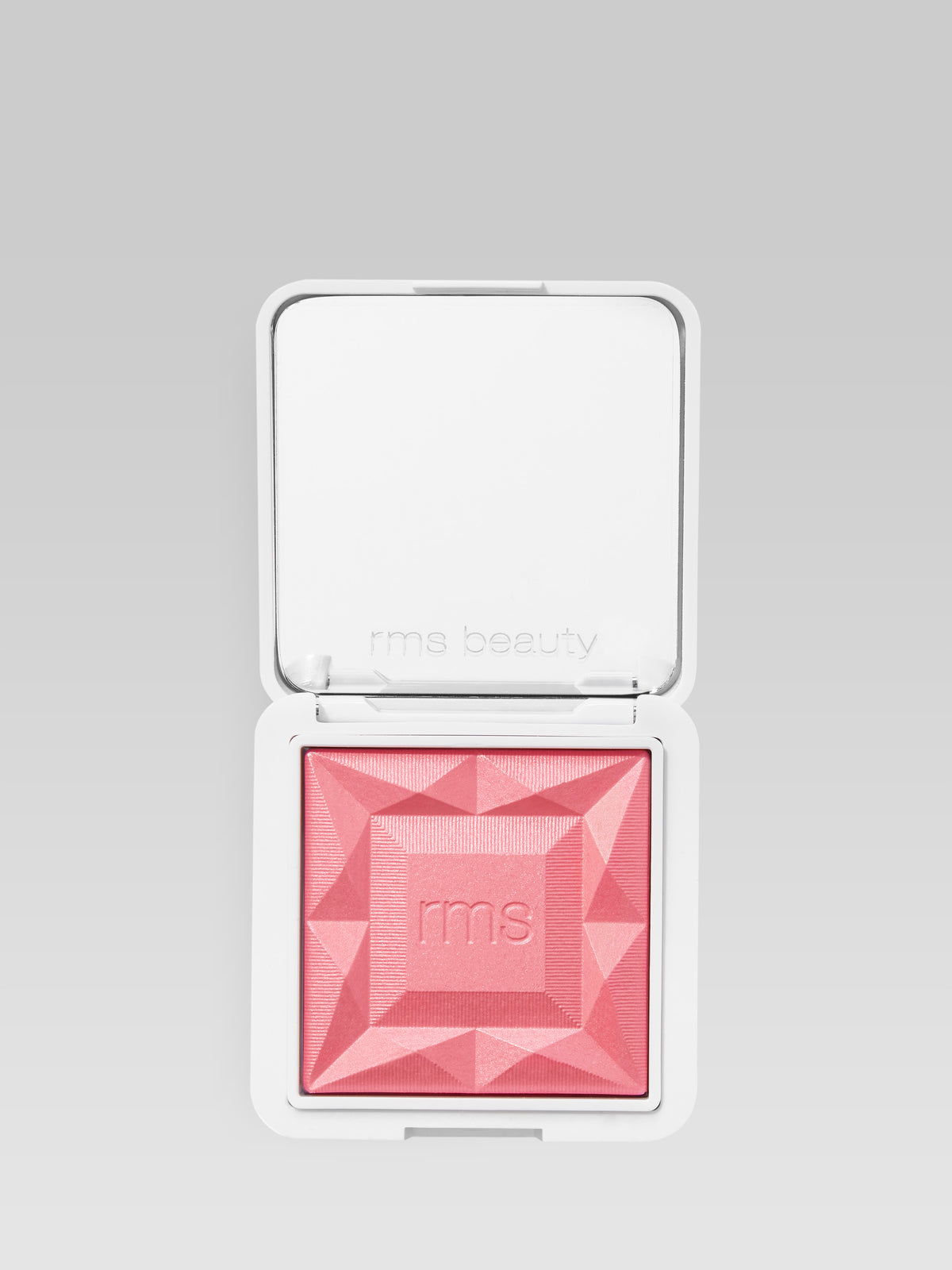 RMS Beauty ReDimension Hydra Powder Blush in French Rose in an open compact with embossed pink blush powder