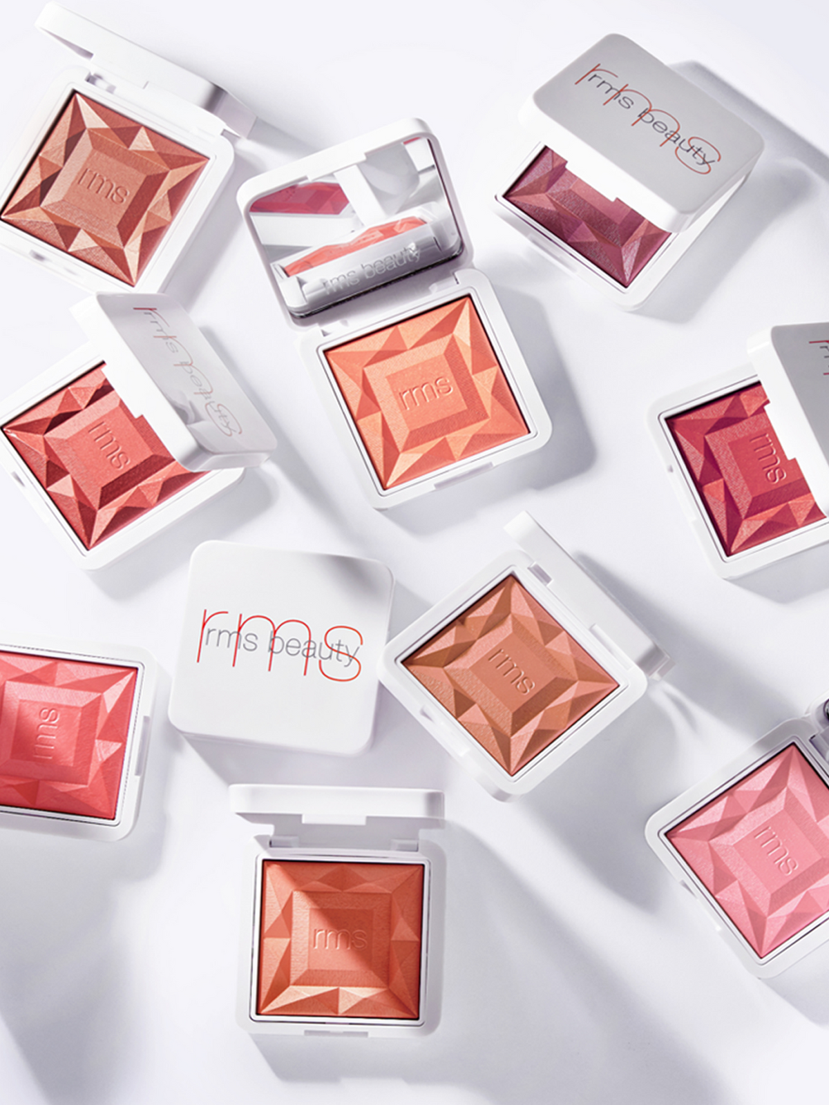 RMS Beauty ReDimension Hydra Powder Blush collection in different shades arranged on a white background