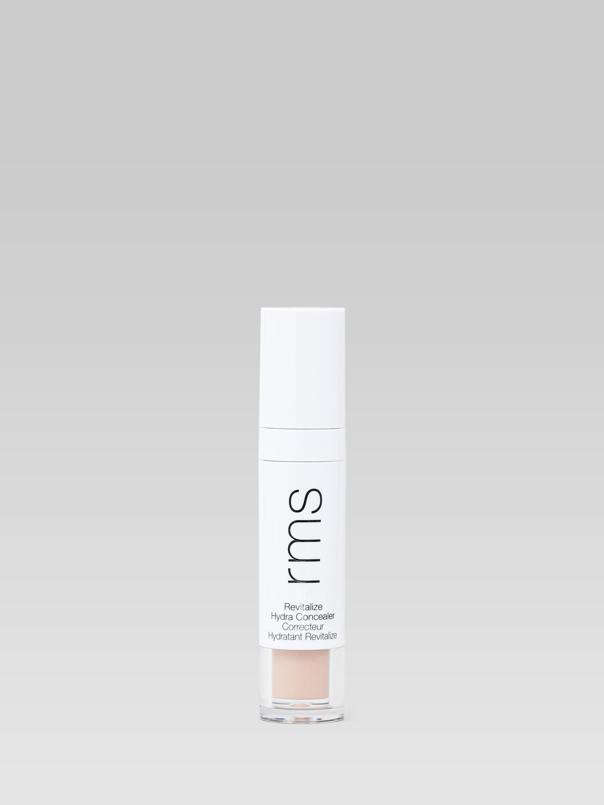 RMS Beauty Revitalize Hydra Concealer in shade WN015, shown in its white tube with a clear base